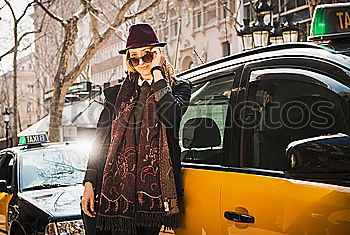 Smoking man looking out of taxi