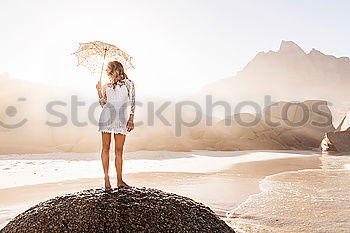 Similar – Man standing on beach Sand