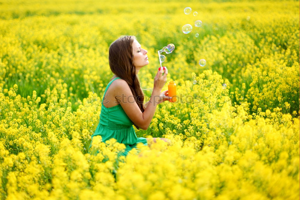 Similar – Pretty girl in youth summer sun with yellow nature flowers. Young woman is attractive, authentic and beautiful. Relaxation and peace from stress, love for environment and dream rest in soul full of happiness.