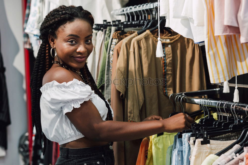 Similar – Image, Stock Photo Pretty sian woman in clothes store