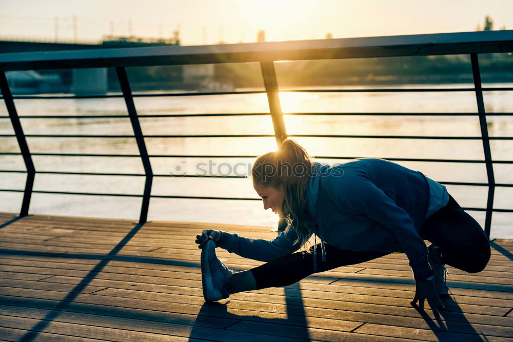 Similar – Young fitness woman runner running on city bridge.