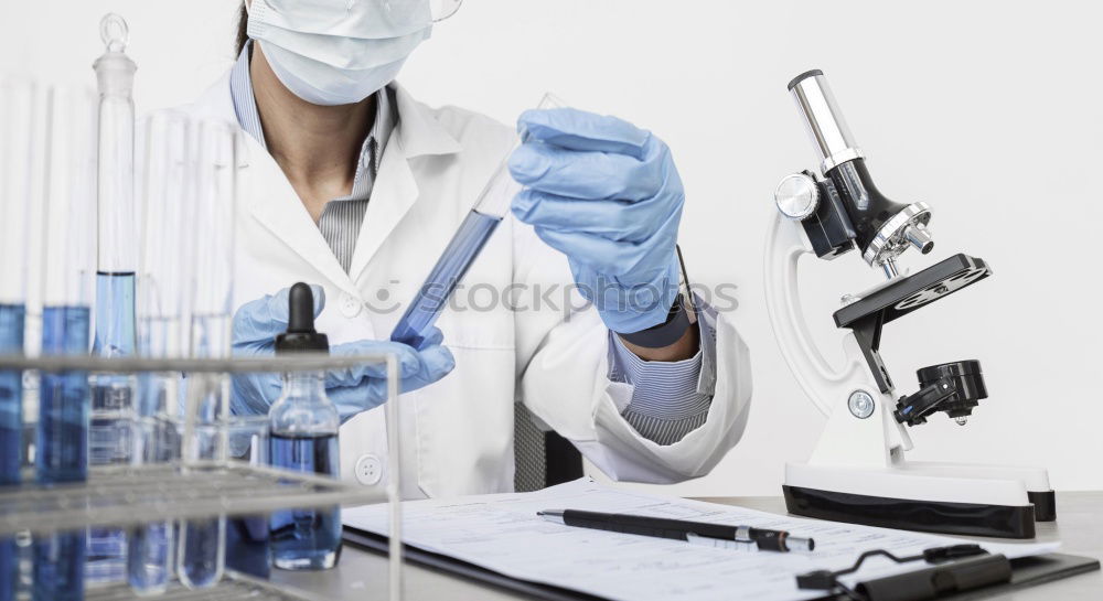 Similar – Image, Stock Photo Worker putting liquid to test tube