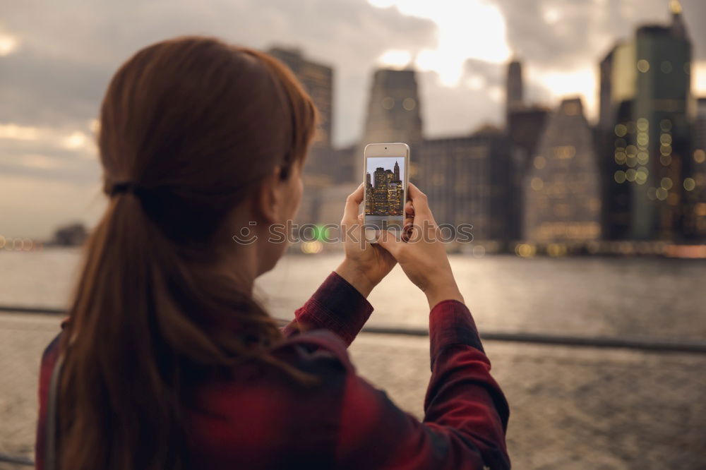 Similar – Image, Stock Photo two friends in the street taking pictures with mobile phone