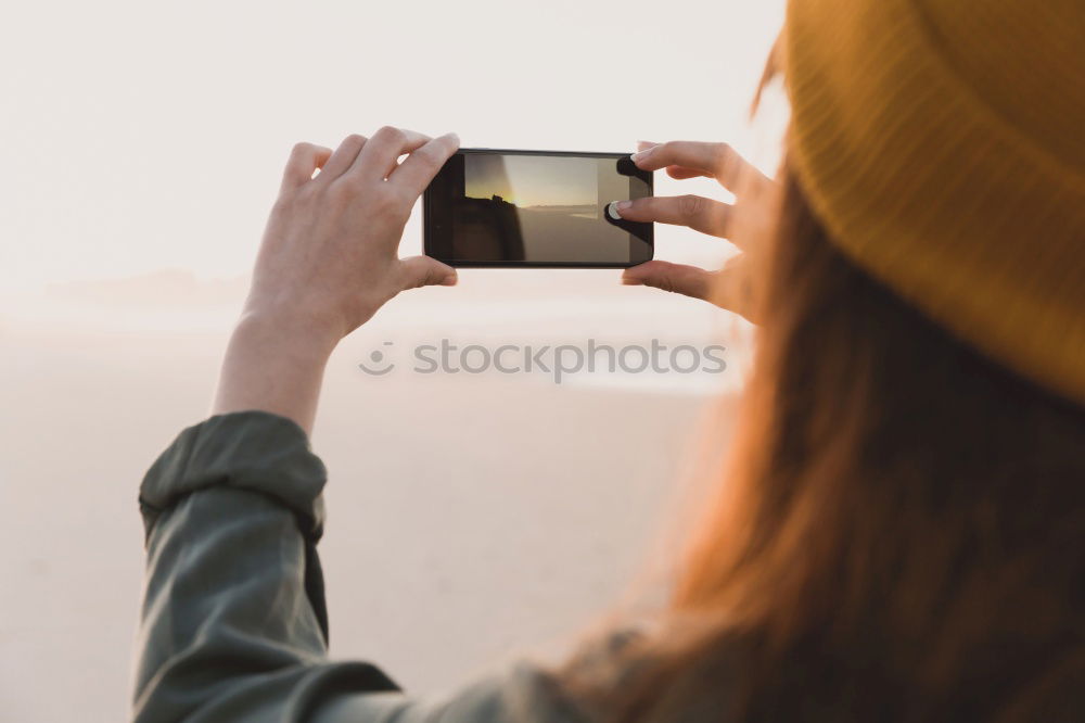 Photographer aiming with vintage camera