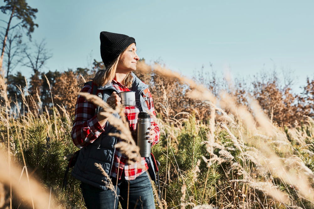 Similar – Girl sitting in autumn forest