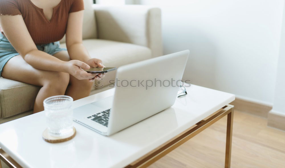 Similar – Mature woman sitting on couch at modern home