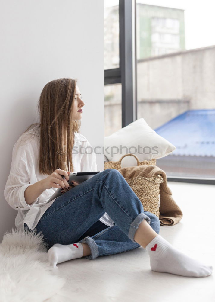 Similar – Image, Stock Photo young woman sitting on her diy couch with phone