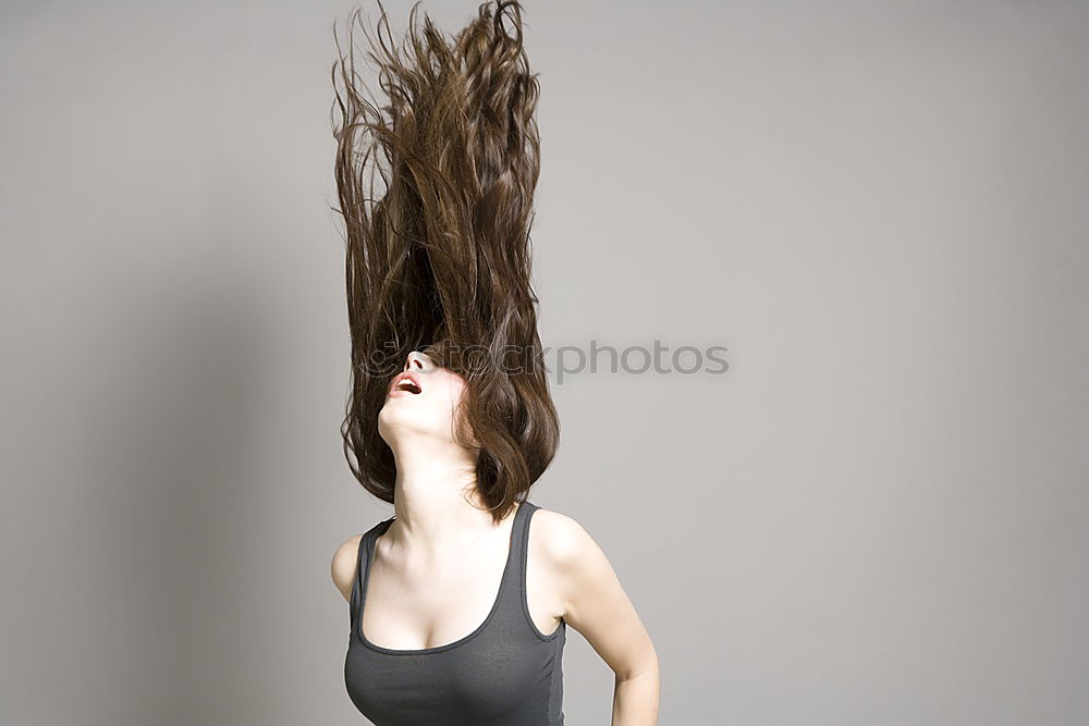 Similar – Woman with flying dreadlocks