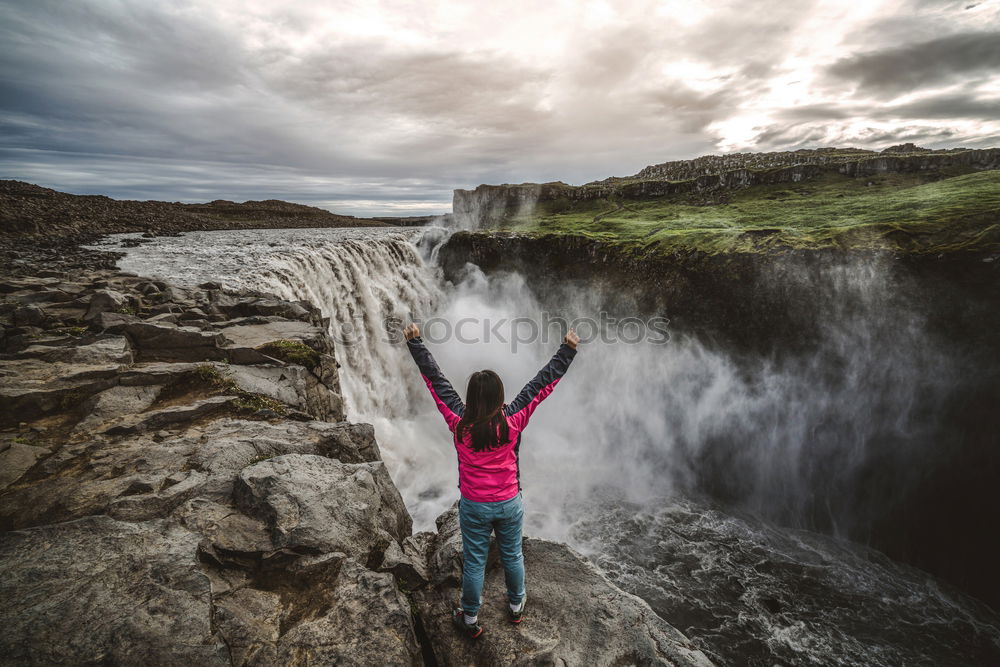 Backpacker jumping on landscape