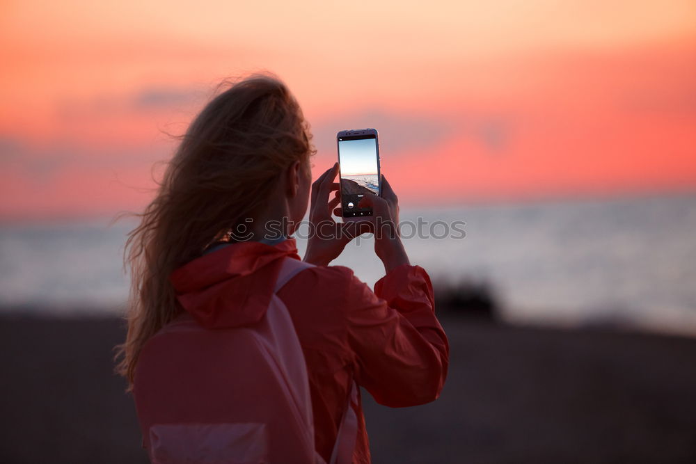 Similar – Image, Stock Photo Happy young woman with tablet PC on beach at sunset. Evening sun, sea and beach on background