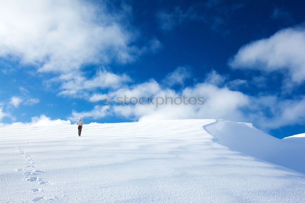 Similar – Image, Stock Photo Mountaineer reaches the top of a snowy mountain