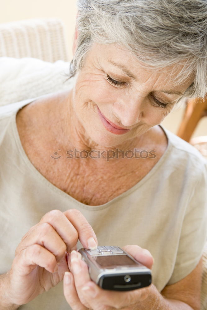 Similar – senior woman using smartphone