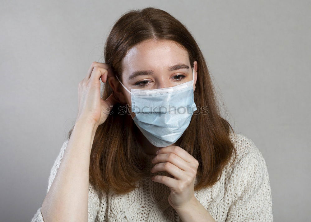 woman wearing an anti-virus protection mask to prevent flu infection, allergies, virus protection, COVID-19, and corona virus pandemic disease 2019