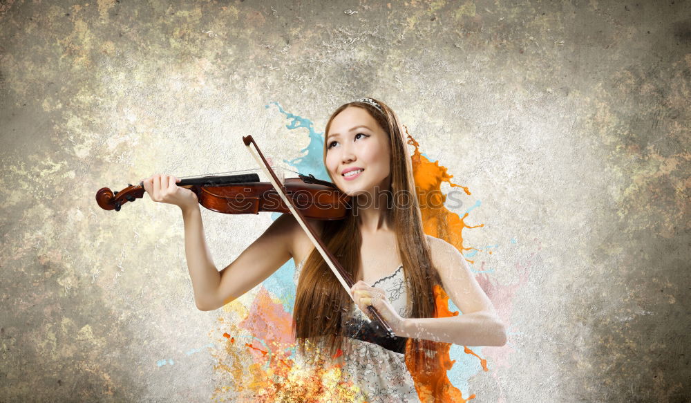 Similar – Pretty young violinist playing the violin