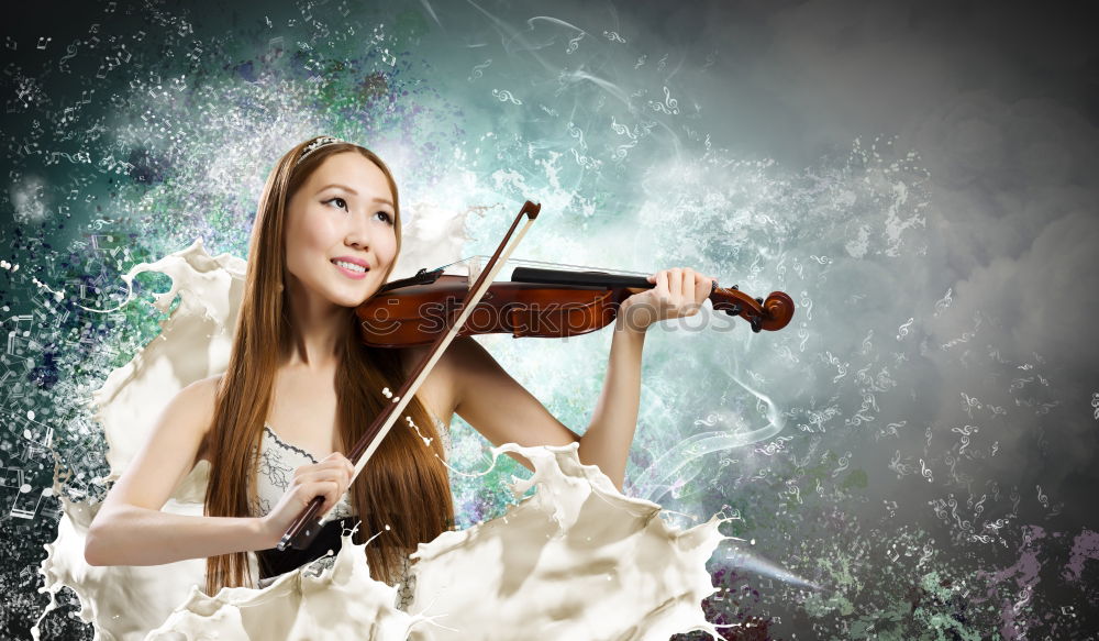 Similar – Pretty young violinist playing the violin