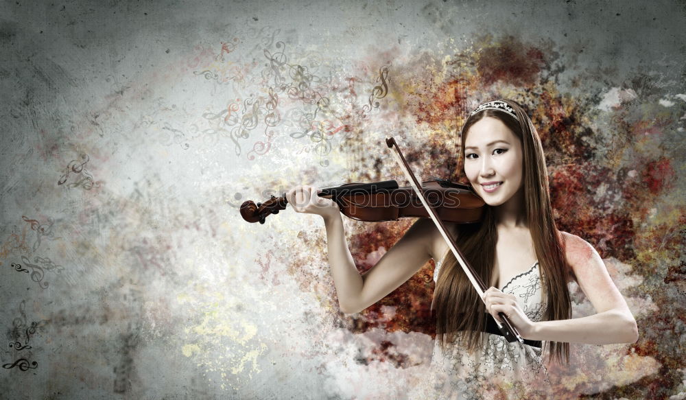 Similar – Pretty young violinist playing the violin