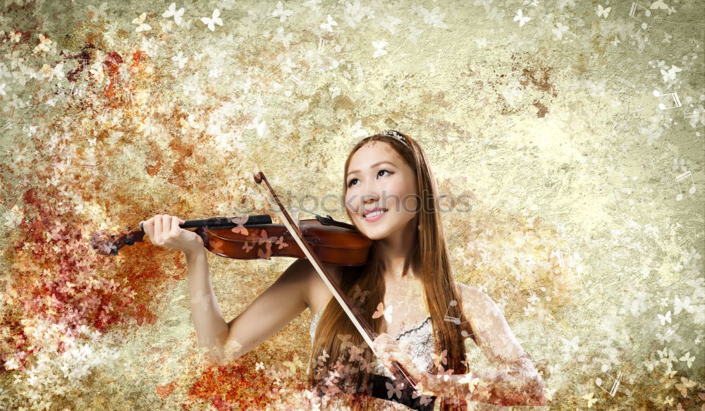 Similar – Pretty young violinist playing the violin