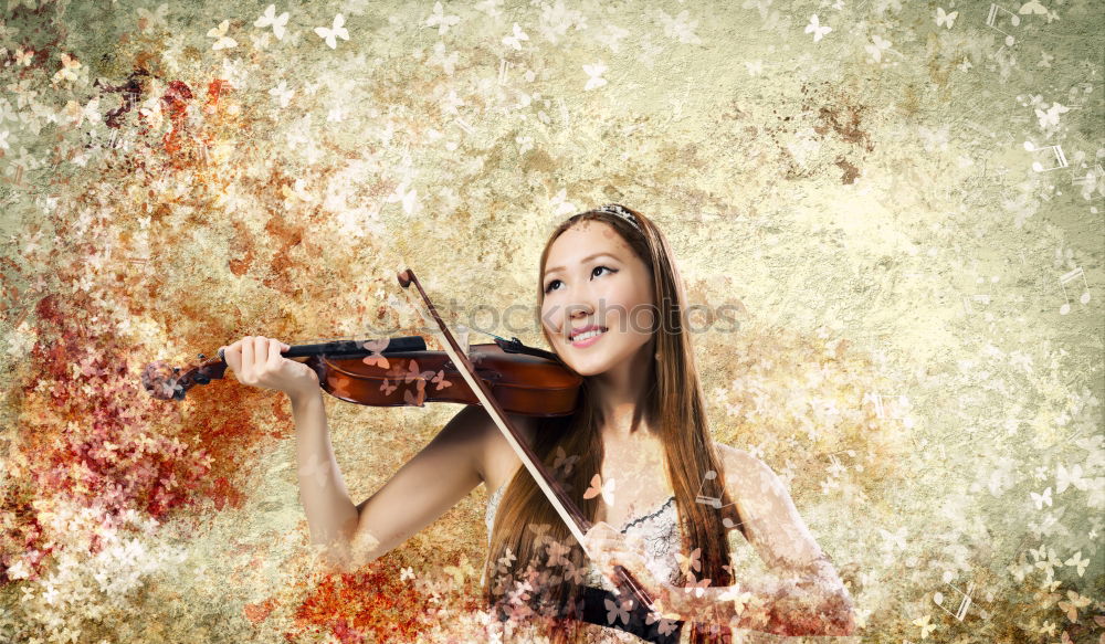 Similar – Pretty young violinist playing the violin