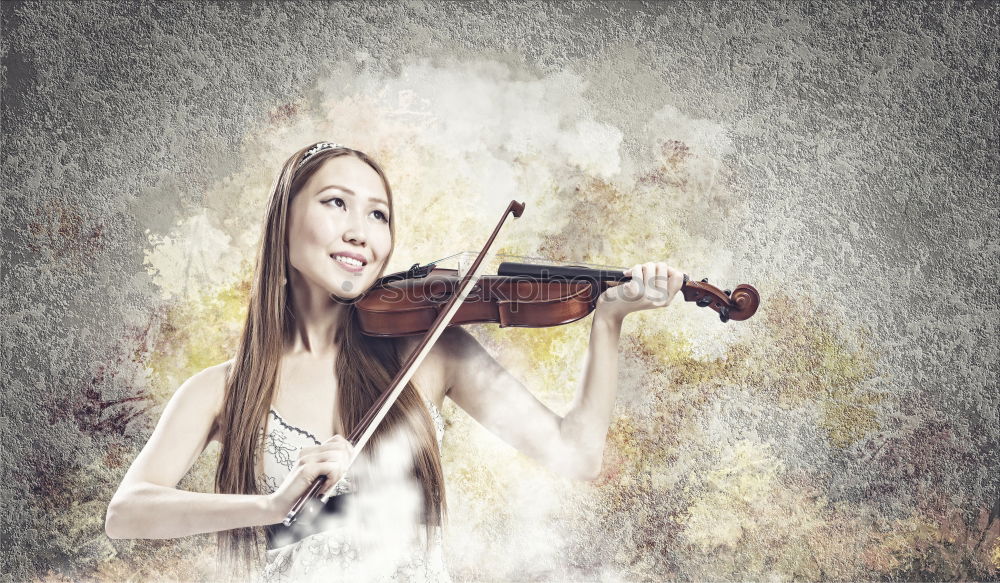 Similar – Pretty young violinist playing the violin