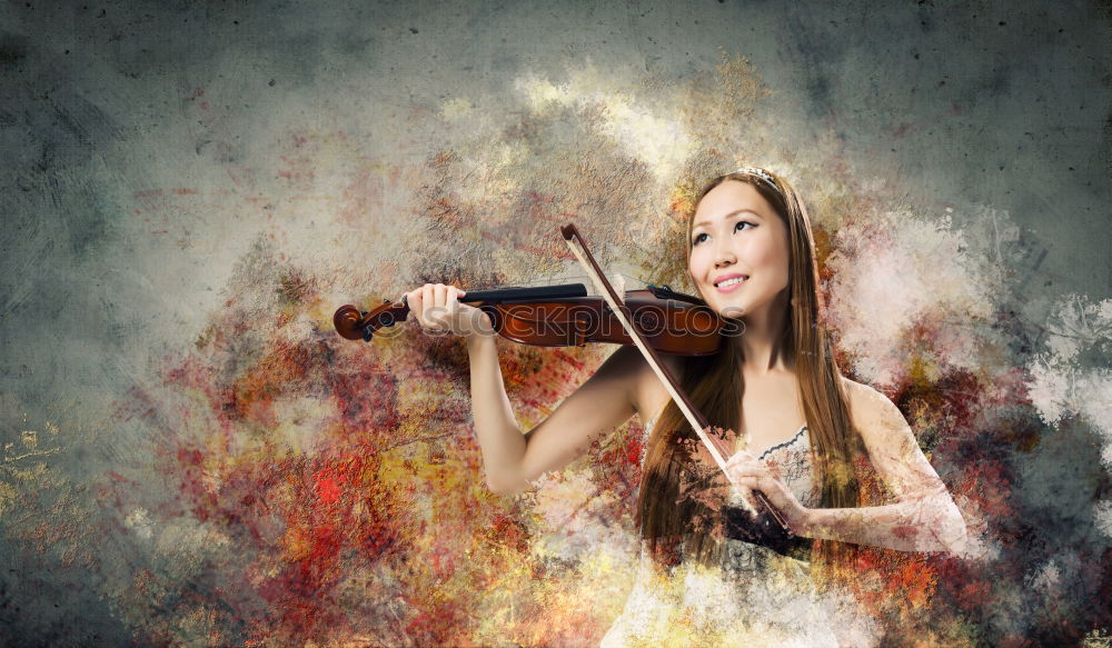 Similar – Pretty young violinist playing the violin