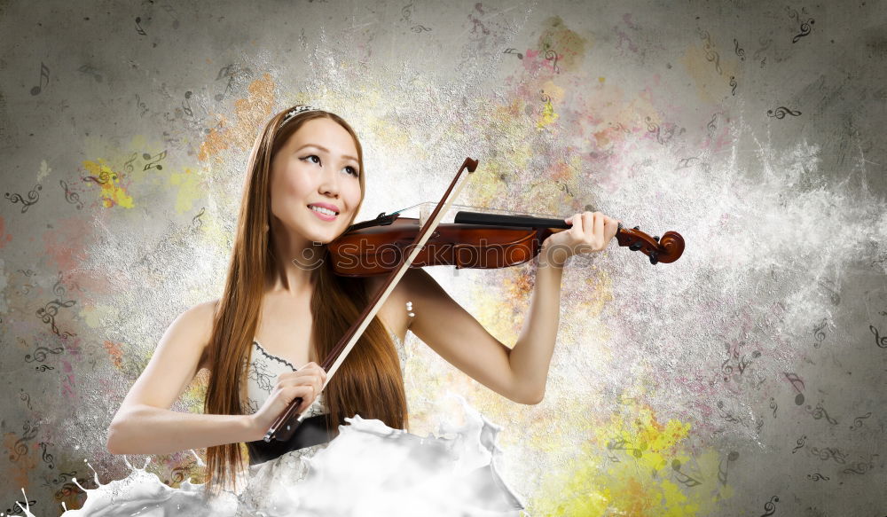 Similar – Pretty young violinist playing the violin