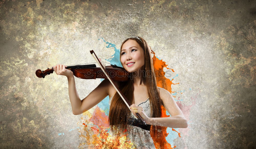 Similar – Pretty young violinist playing the violin