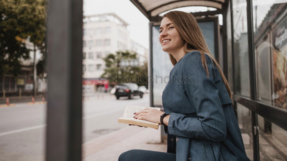 Similar – Fröhliches Mädchen steigt am Bahnhof mit Kaffee in der Hand in den Zug ein.