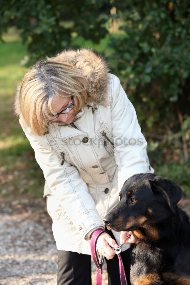 Similar – Woman with dog in the city