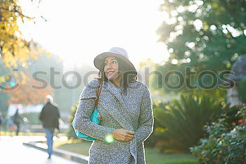 Similar – Image, Stock Photo Black young woman riding a vintage bicycle