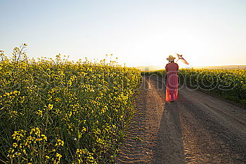 Similar – Image, Stock Photo Young woman walking in a path in the middle of a vineyard