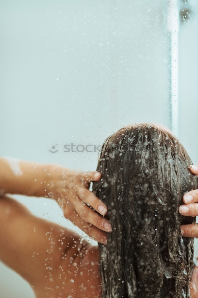 Similar – Woman shampooing her long brown hair