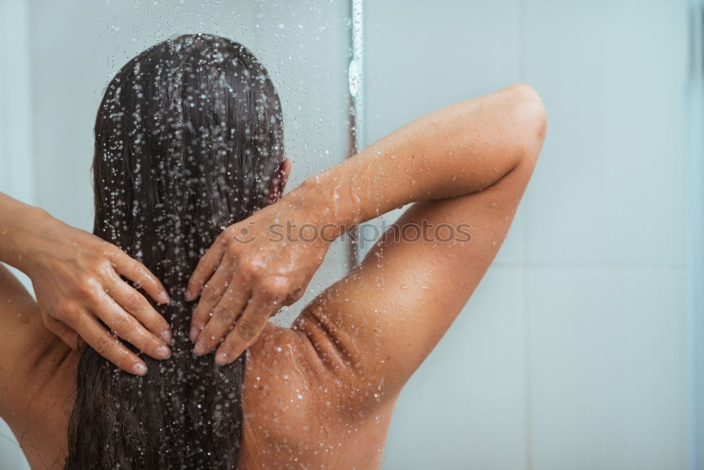 Similar – Woman shampooing her long brown hair