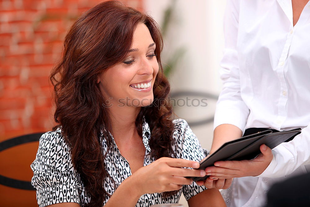 Similar – Image, Stock Photo Two male teenagers surfing the internet on tablet computer while sitting in cafe. One young man pointing at screen