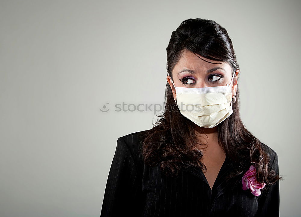 Similar – Image, Stock Photo Young pretty woman looks anxiously into the camera with wrinkled forehead and mask. Red Nose Day with funny, funny clown mask, with red bobble, pompom to protect against corona. Blonde, young, long-haired woman with cool face mask outside in the nature.