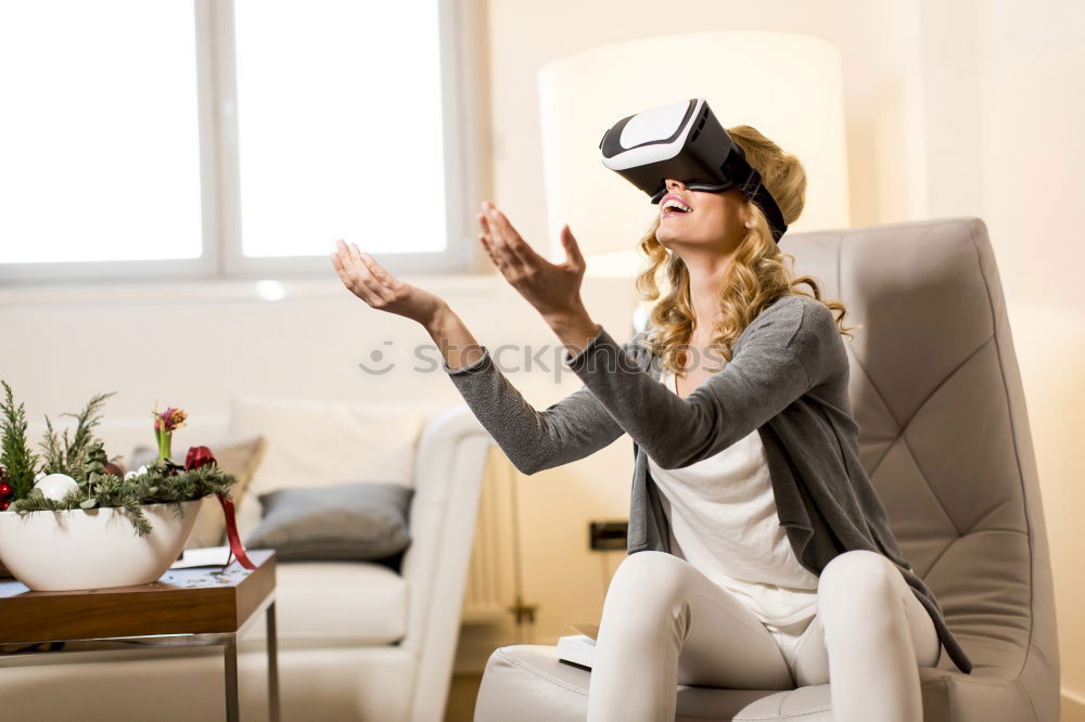 Similar – Image, Stock Photo Woman experiencing virtual reality in home