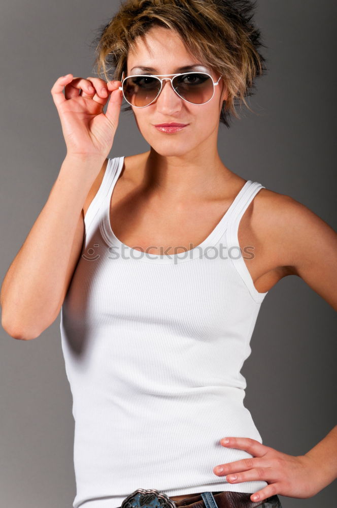 Similar – Girl with blonde hair posing in front of turquoise background