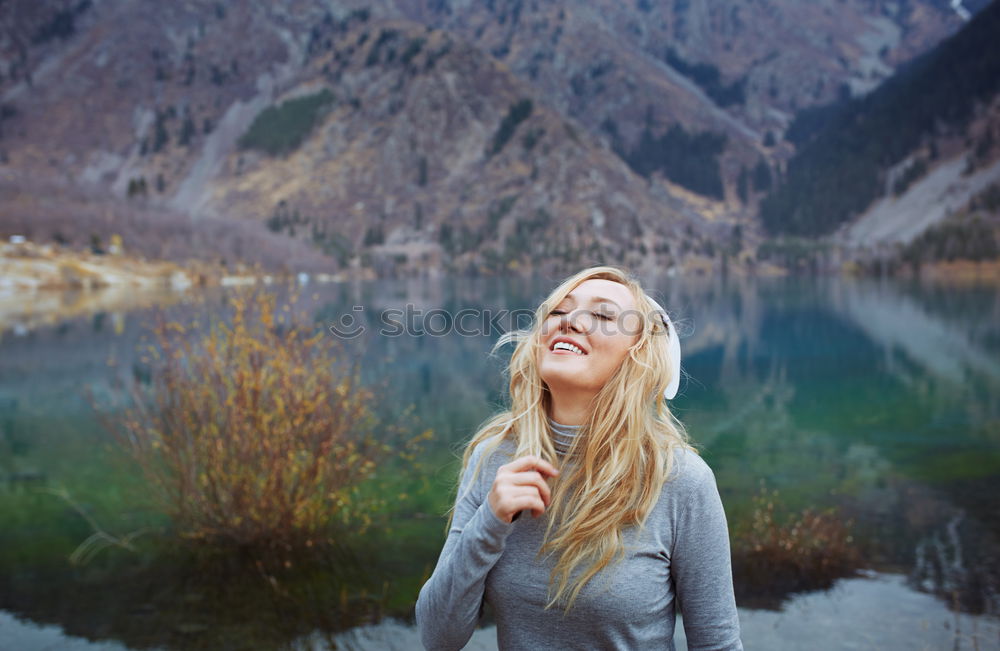 Similar – Smiling woman at lake