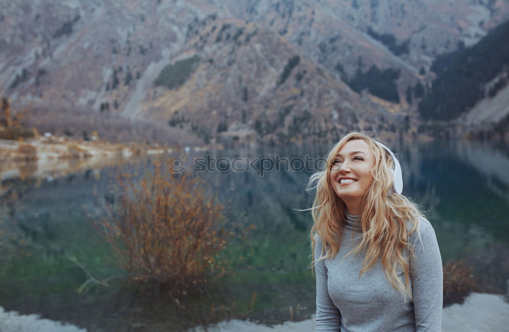 Smiling woman at lake