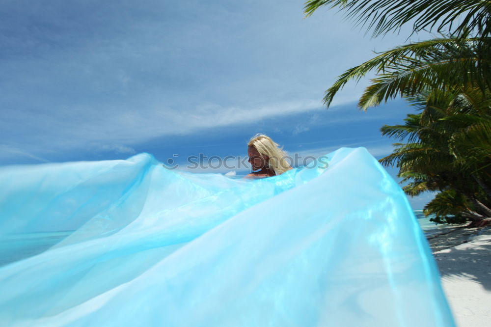 Similar – Woman in lagoon on tropical island