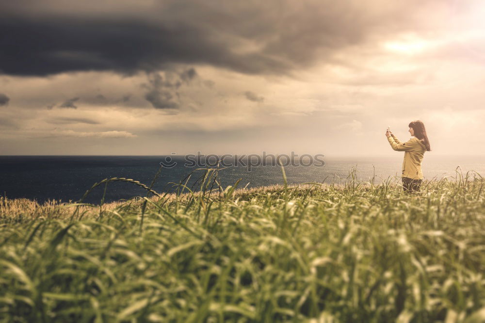 Similar – Young woman posing on a hill