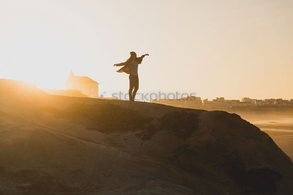 Similar – Close-up of man standing on longboard on promenade