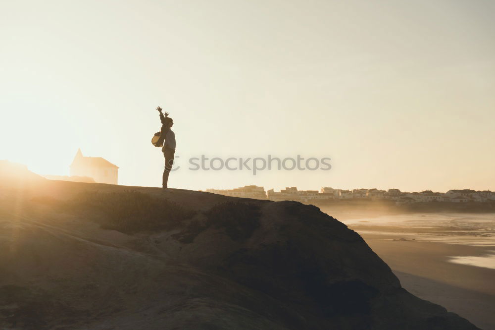 Similar – Image, Stock Photo Person on cliff on seashore