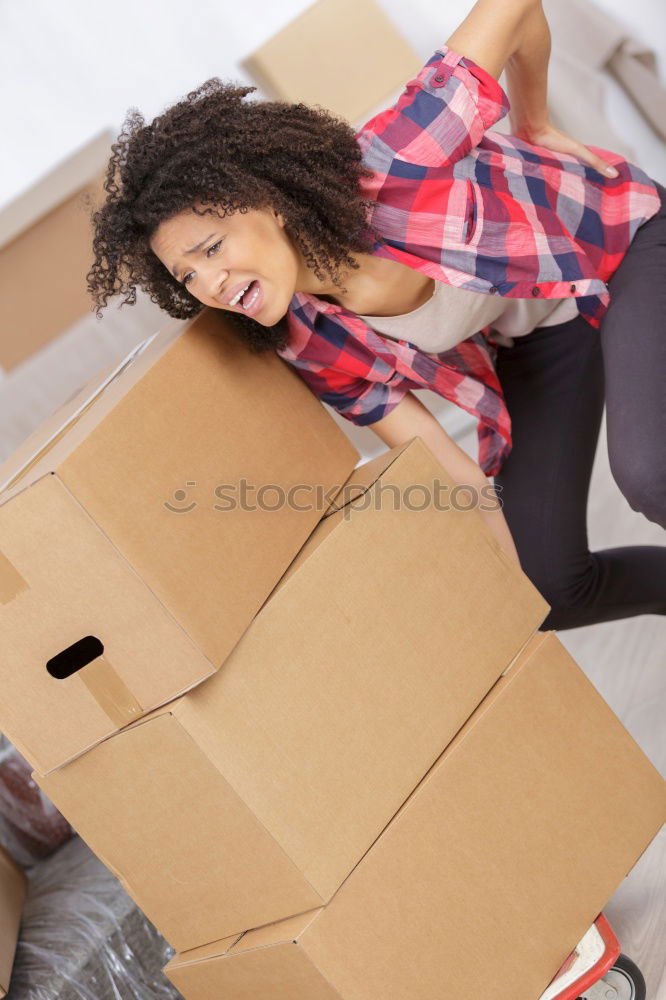 Similar – young woman sits in moving box