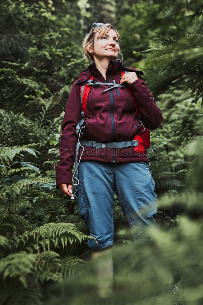 Similar – rothaariger hübscher Teenager, langhaarig mit schwarzer Sonnenbrille, blauer Jacke, orangefarbenem Schirm im Wald