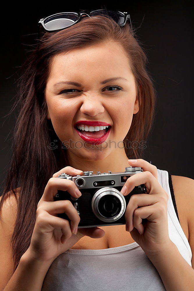 Image, Stock Photo Young woman taking pictures with an instant camera