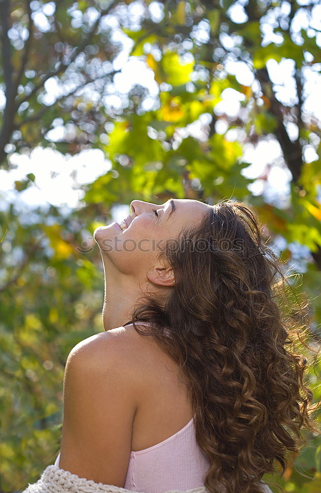 Similar – Image, Stock Photo Side portrait of tall beautiful woman with long dark curly hair in nature