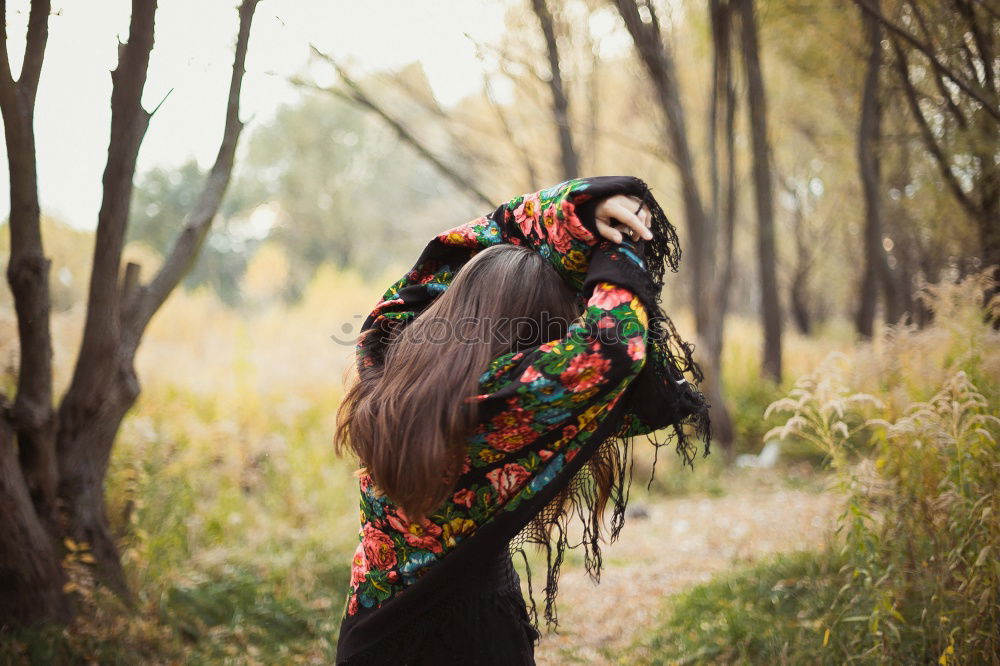 Similar – A young woman looking at a tree.