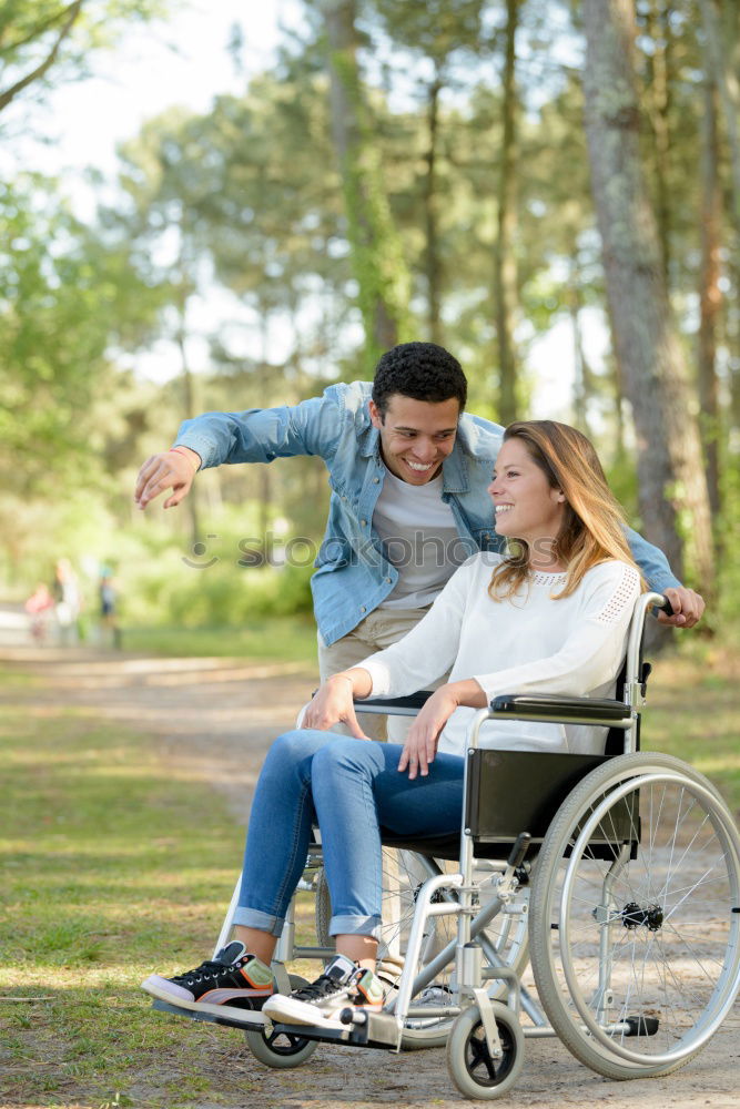 Similar – Foto Bild Frau und ihr Freund im Rollstuhl machen einen Spaziergang durch den Park an einem Fluss und genießen den Herbst