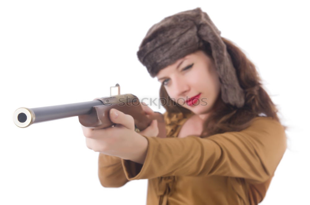 Similar – Attractive young woman with a rifle at the ready aims at her target and has her finger on the trigger