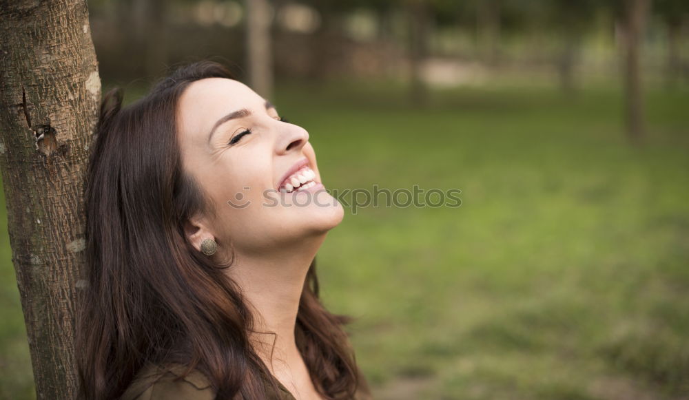 Similar – Image, Stock Photo Portrait of pretty woman smiling in nature